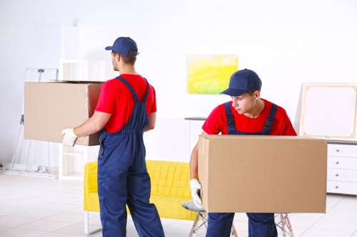 Professional movers packing and loading boxes in South Kensington