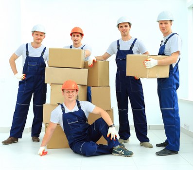 Office removals team handling boxes and desks in South Kensington