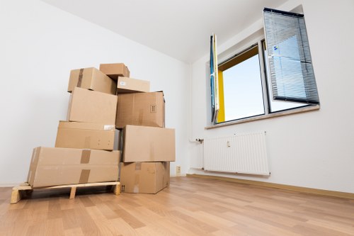 Unpacking boxes in a South Kensington flat