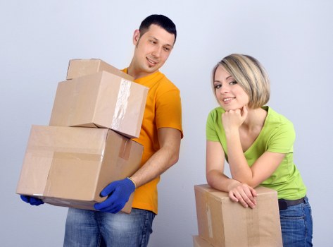 Moving crew following safe handling practices with protective gear