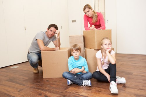 Staff managing obstacles to prevent slips and trips during a move