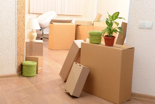 Business relocation setup with labelled boxes and desks in South Kensington